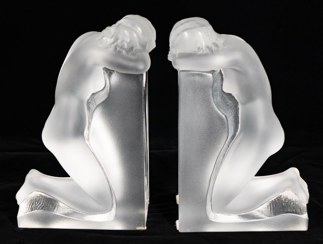 Lalique Nude Bookends: A pair of Lalique nude bookends. Both are signed on the underside for Lalique and retain the original sticker.