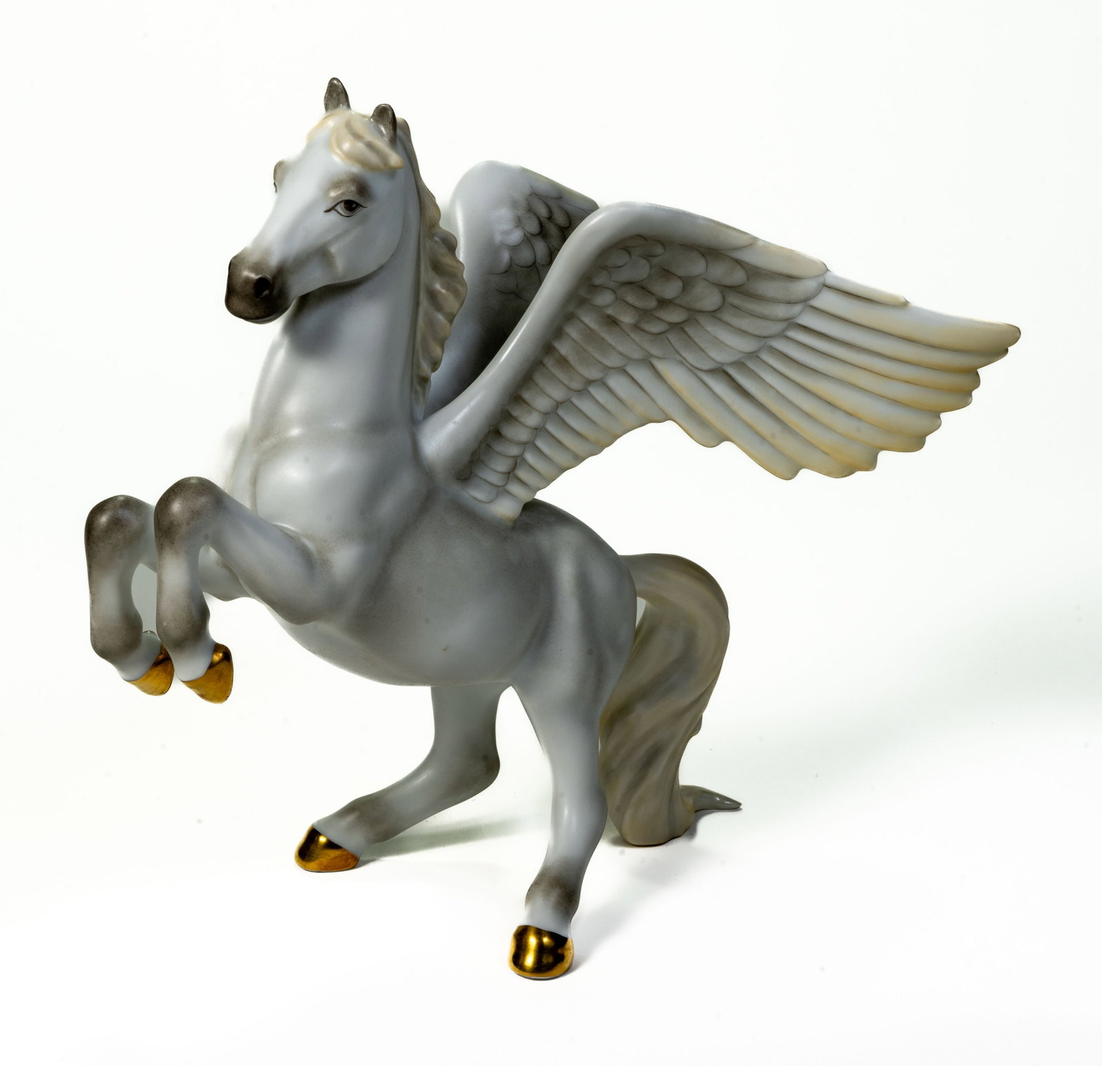 Herend Pegasus Porcelain Sculpture: A Herend Pegasus porcelain sculpture. Stamped on the underside of the feet for Herend. Size: 7H x 8W. Provenance: Rulle Collection