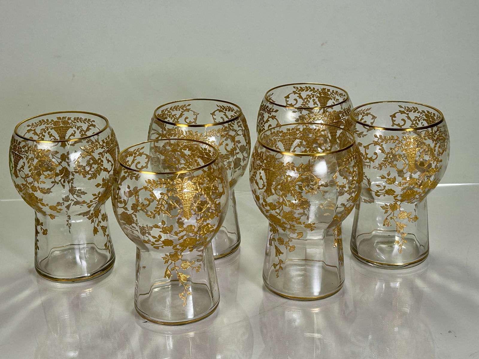 Six (6) Cambridge Glass Co. Portia Gold Encrusted Tumblers: Six (6) Camcridge Glass Co. gold encrusted tumblers having allover floral and leaf motif. Size: 4.5H x 3.25W (each).