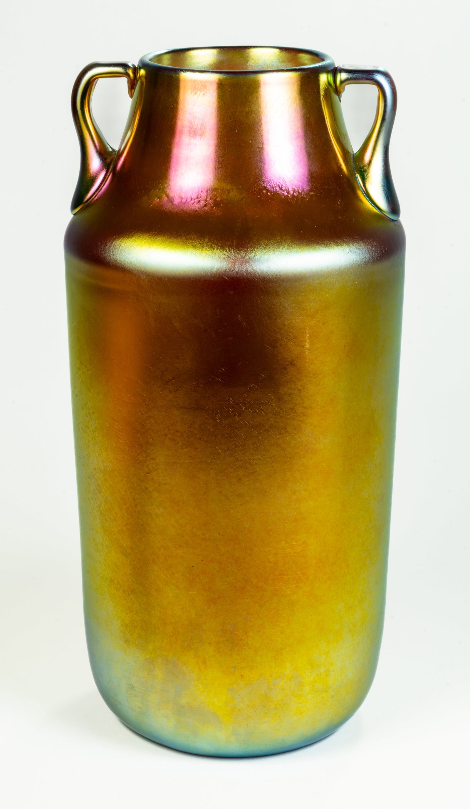 Steuben Gold Aurene Double Handled Glass Vase 10": An antique Steuben gold Aurene double handled vase. etched on bottom ST2413. Size: 10H x 5W