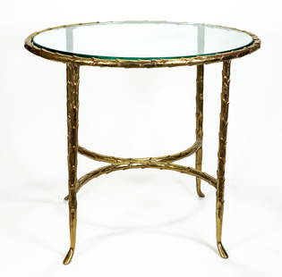Maison Bague style Gilt metal glass top end table: A Maison Bagues style Acanthus form gilt metal glass top table.