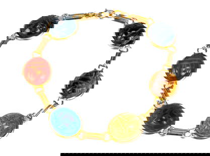 14k Gold Six Scarab Bracelet: Egyptian revival 14k yellow gold bracelet composed of six oval cabochon and carved gemstones, including tiger's eye, quartz of different colors, carnelian, etc., linked with double wire connectors,