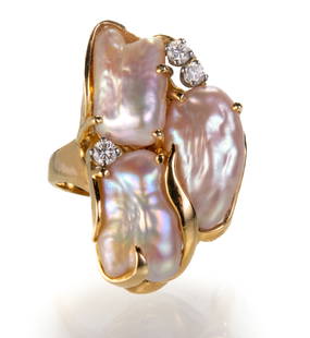 14k Gold Pearl and Diamond Ring: 14k yellow gold ring with three baroque pearls set in a half bezel/half prong setting. Three small four-prong set round cut diamonds (one diamond is 0.07 ct. and the other two are 0.10 ct.) 