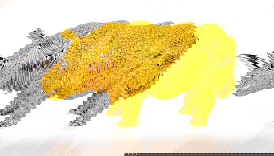 18k Henry Dunay Rhinoceros Brooch: 18k yellow gold and platinumbrooch. The rhinoceros body is a textured finish in 18k yellow gold with the eye and horn of platinum. Designer: Henry Paul Dunay. Measurements: Approximately 2 1/2 inches