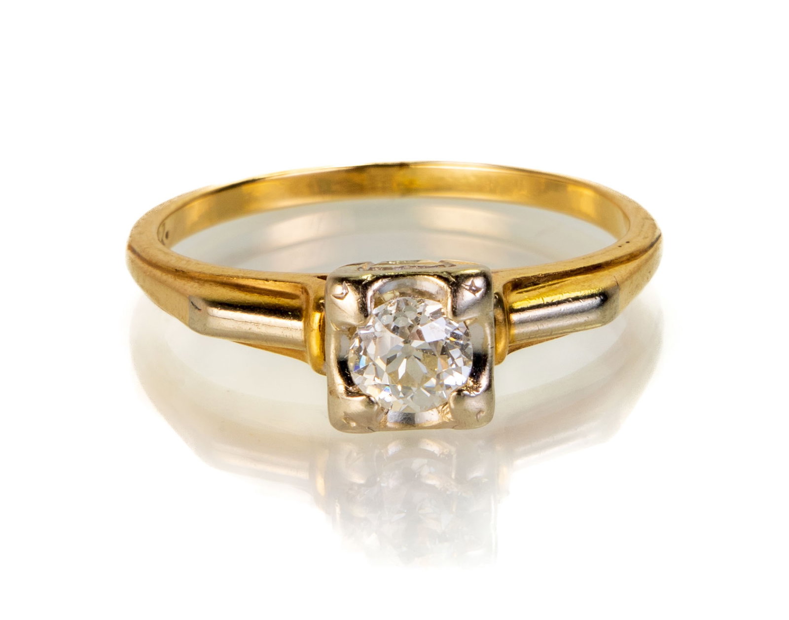 14k Yellow Gold Diamond Ring: 14k white and yellow gold engagement ring with a bead set round brilliant cut diamond (estimated at 0.25 ct.). Ring Size: 7. Markings: 14k, inscribed ".IK." Total weight: 1.2 dwt (1.9 g). Please note: