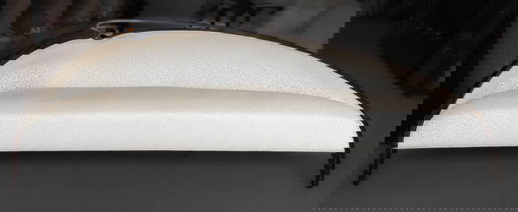 Christopher Guy "Swirl Gauche" Sofa: A Christopher Guy "Swirl Gauche" sweeping chaise lounge sofa with assymetrical slant complemented by a delicate swirl of carved ebonized mahogany. Frame of same ebonized mahogany with Christopher