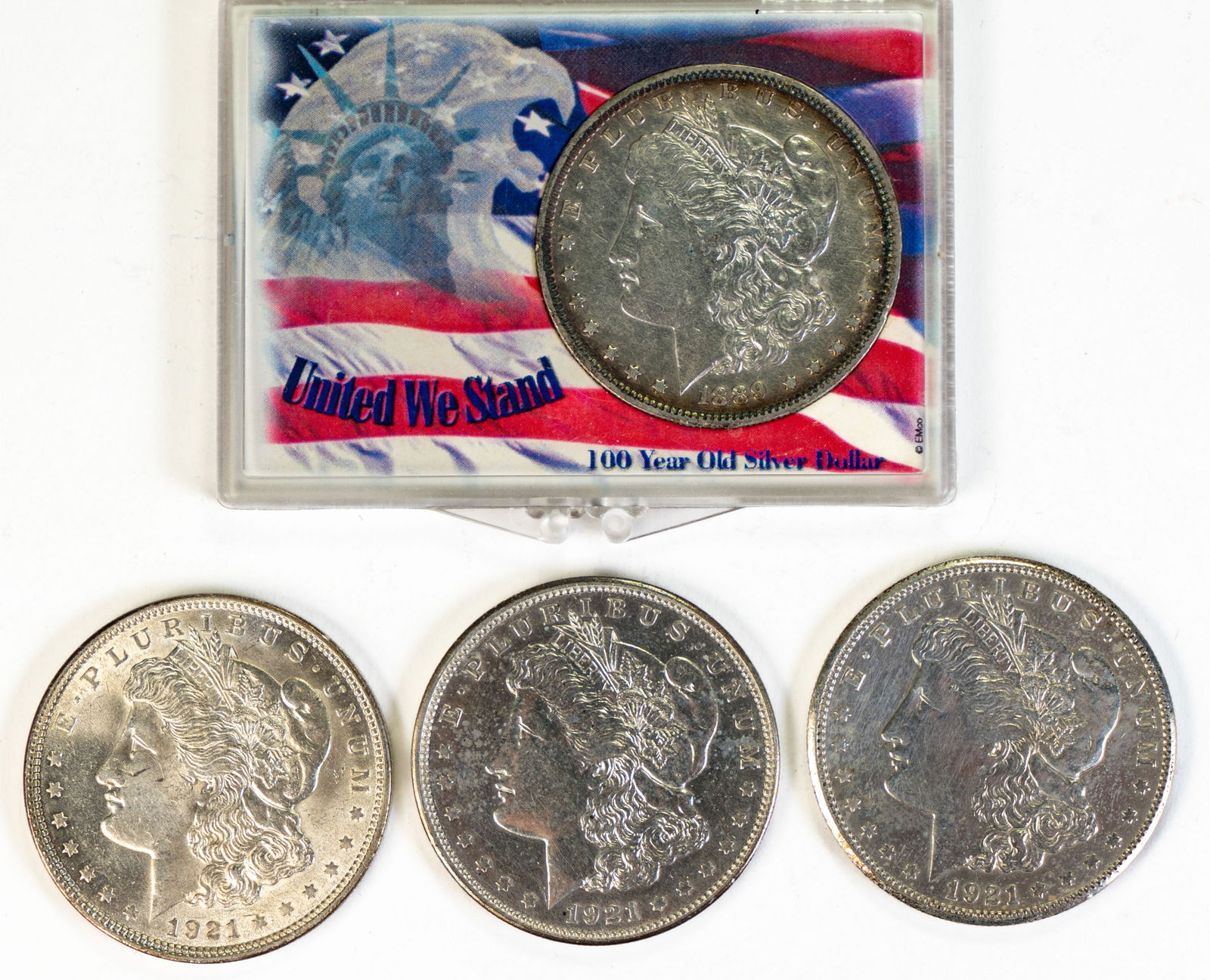Four (4) Morgan Silver Dollars (1 of 4)
