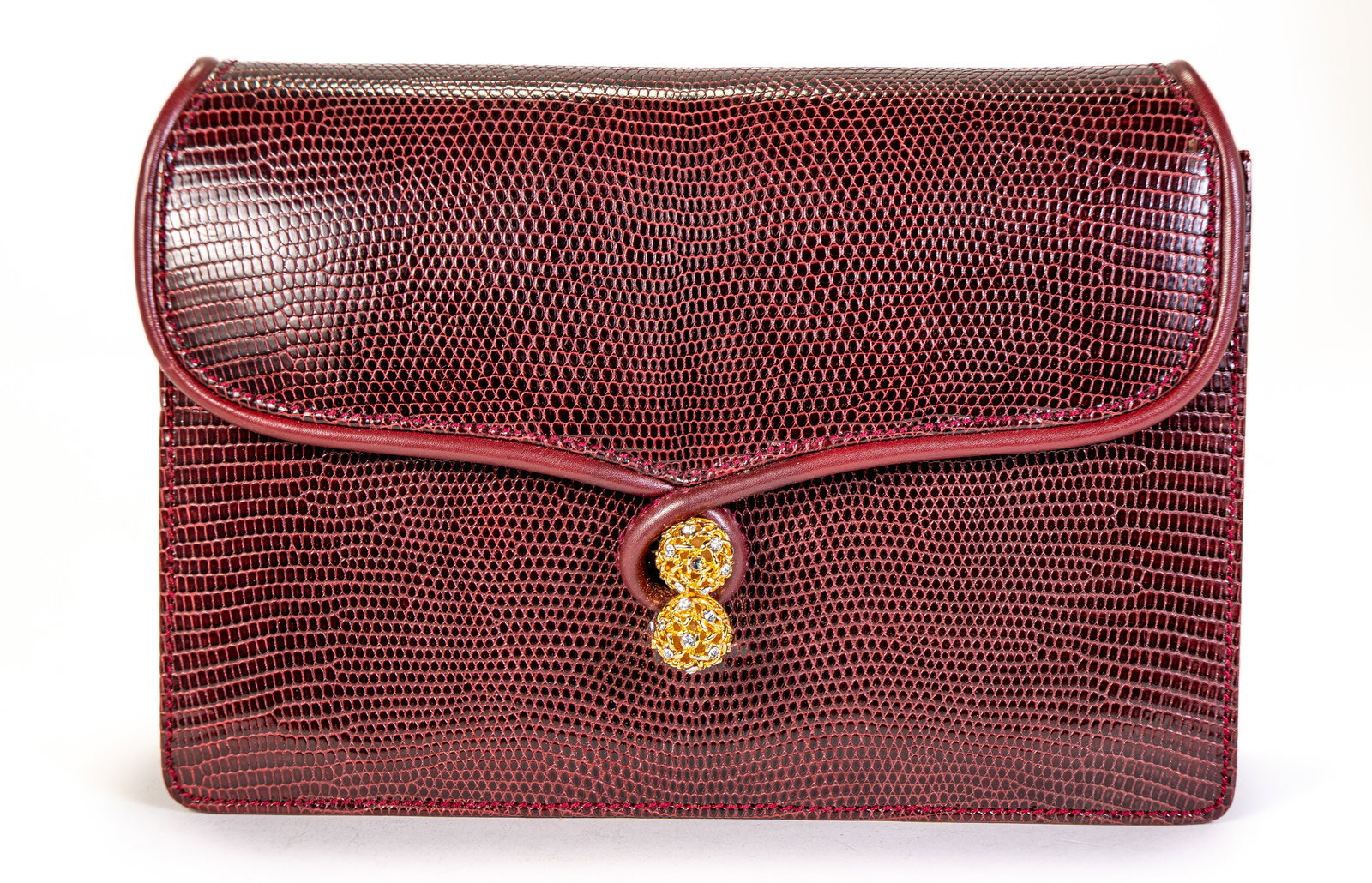 Vintage Gucci Burgundy Lizard Bag: Vintage Gucci burgundy color lizard shoulder bag, missing the gold chain strap, that can be used as clutch, with a rhinestone covered two-ball metal snap closure. Cream colored interior, with a zipper