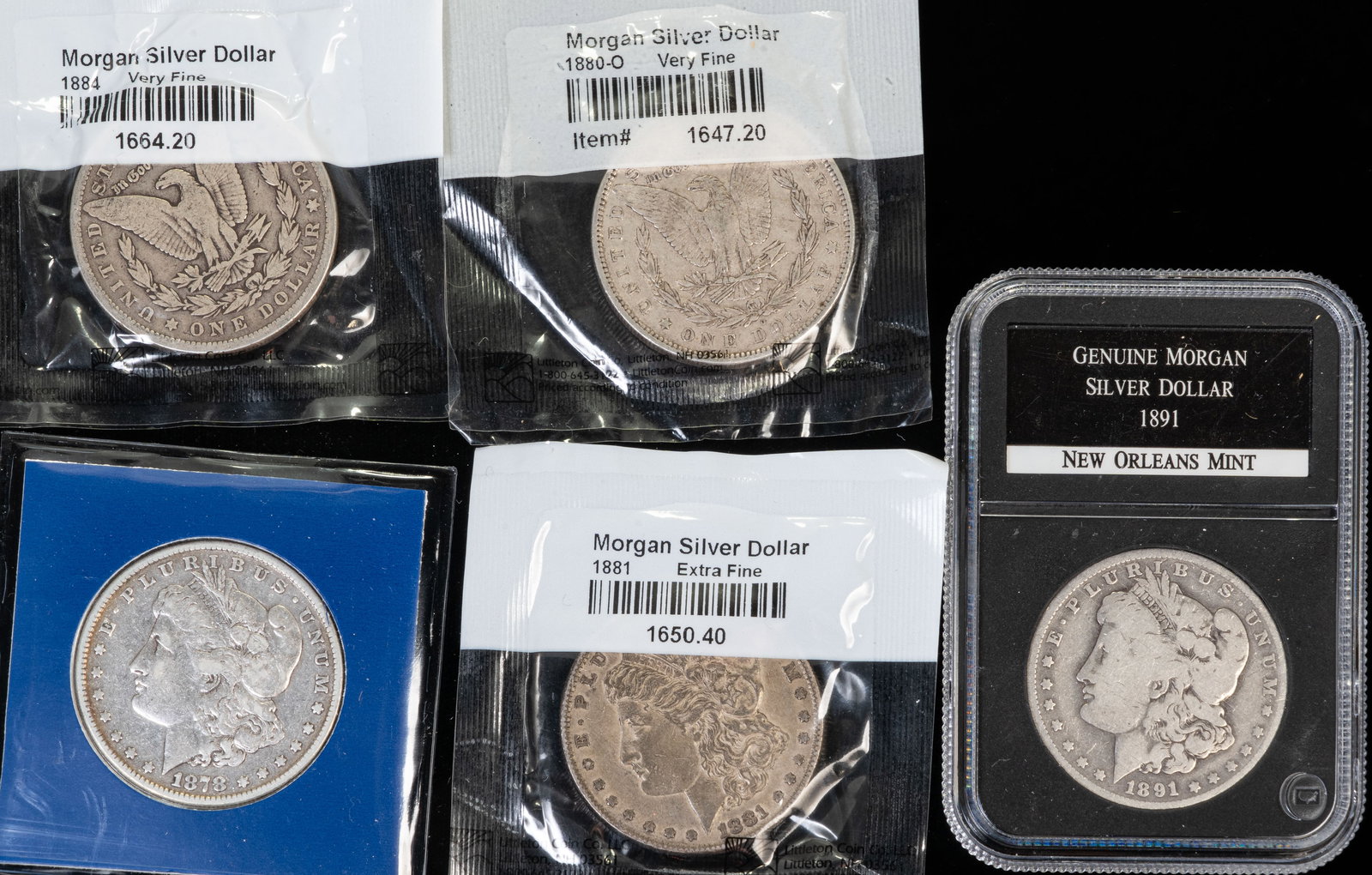 Five (5) Morgan Silver Dollars: Five (5) Morgan Silver Dollars. 1878, 1880 O, 1881, 1884, and 1891 O.