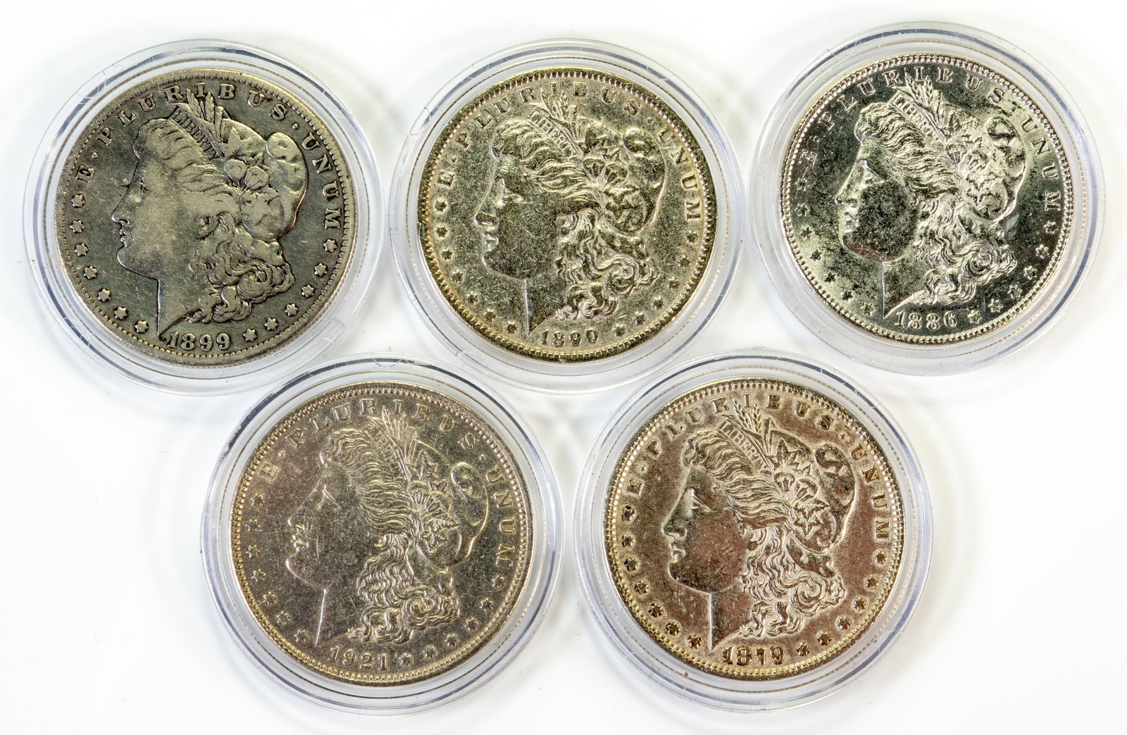 Five (5) Morgan Silver Dollars: Five (5) Morgan Silver Dollars. Years: 1879, 1886, 1890, 1899 O, 1921.