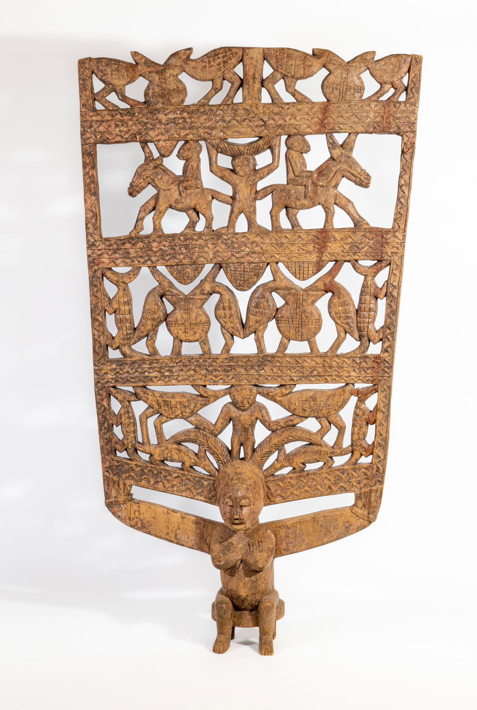 Large African Senoufo Procession Ritual Panel: Large African Senoufo Ritual panel. The base is a female statue evoking the deity Katieleo. Her arms extended carrying intricately carved figures of animals and people. Measurements: 62.75 in. high x