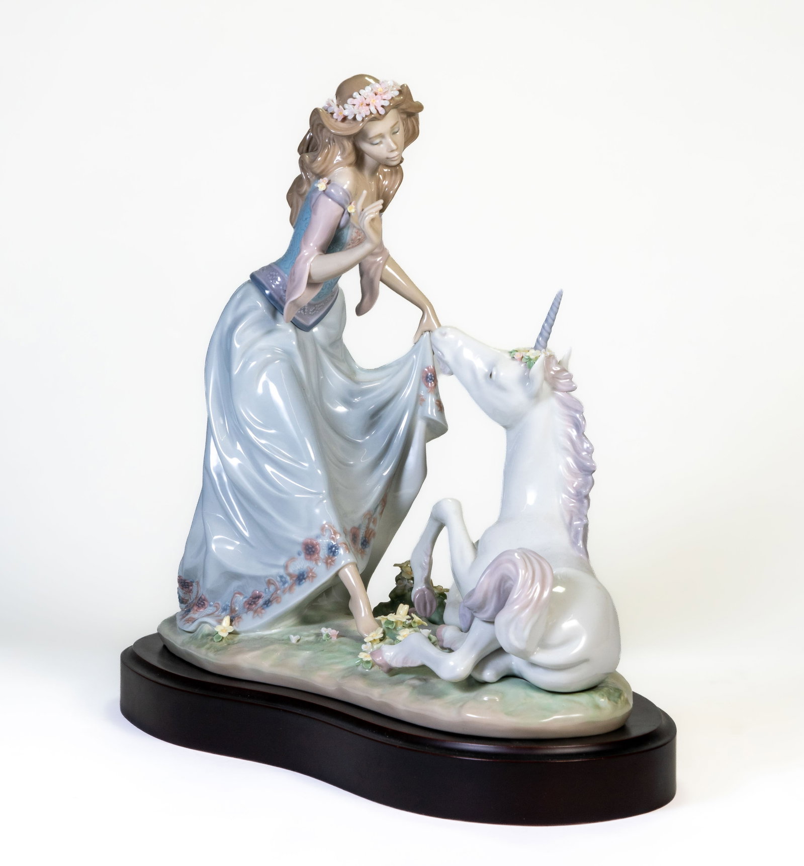 Lladro Figural Group "The princess and the Unicorn": Lladro figural group ?Princess and the Unicorn.? Limited edition of 1500. Includes wooden base. No box or papers. Measures 11.5 in. tall x 12 in. long. No damage or losses.