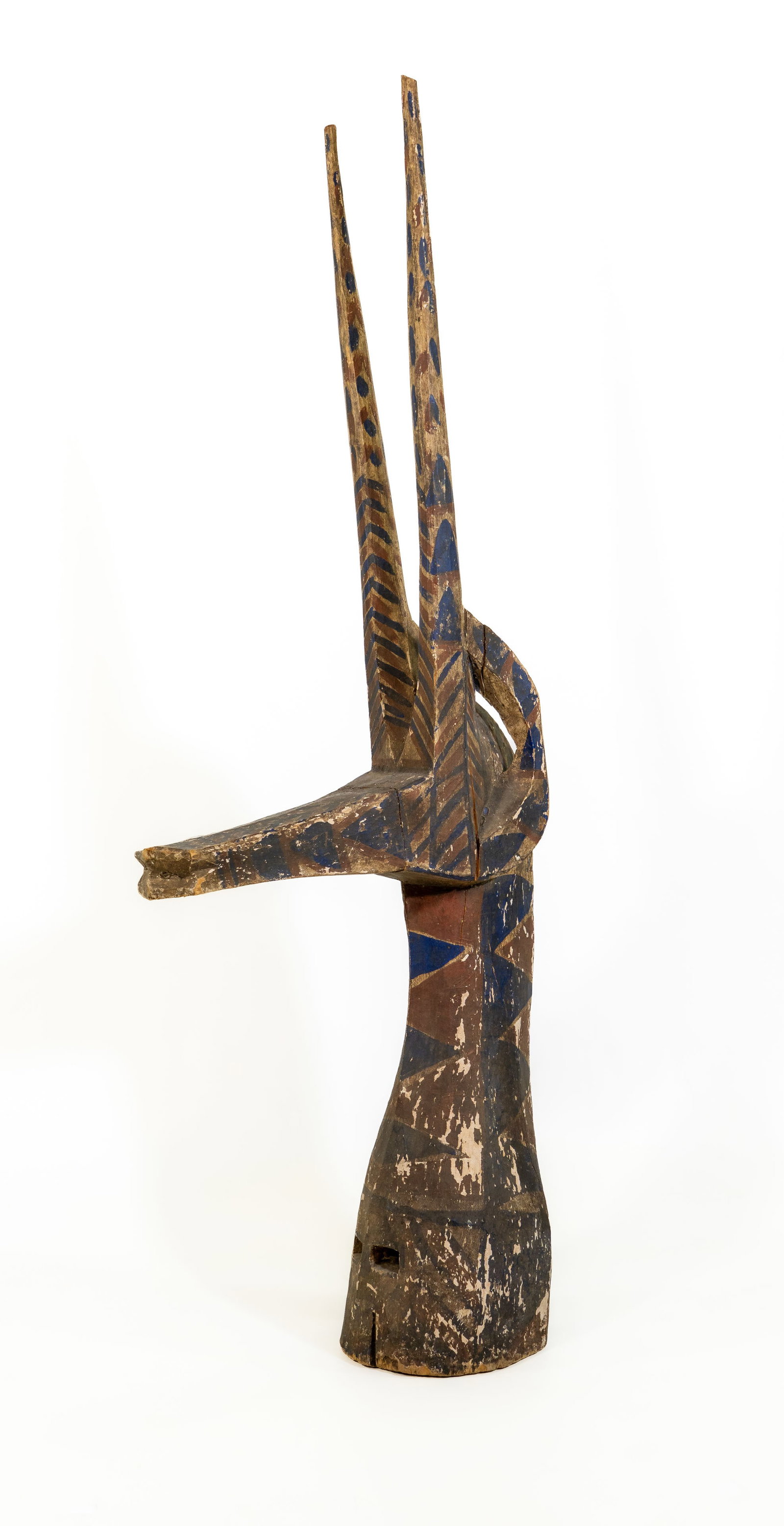 Kurumba Antelope Headdress, Burkina Faso: Kurumba Antelope Headdress, Burkina Faso. Painted abstract sculpture used as ancestral headdress or altar element. Geometric designs relate to cosmological or clan origin stories. Reference: