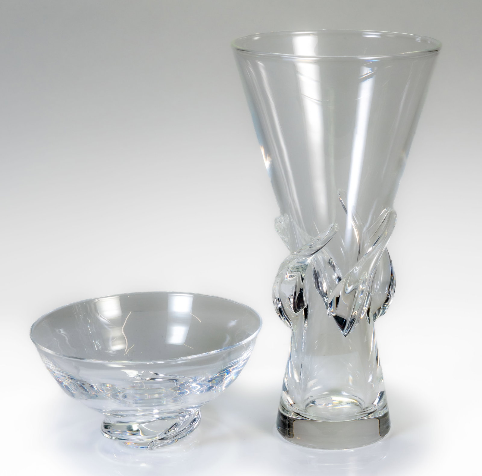 Steuben Rose Vase by George Thompson & Steuben Spiral Bowl: Two pieces of Steuben crystal: tall vase (George Thompson design, 11.5 in. tall) and spiral bowl (3.5 in. high x 7 in. wide). Both signed Steuben. Good condition, no scratches or losses.