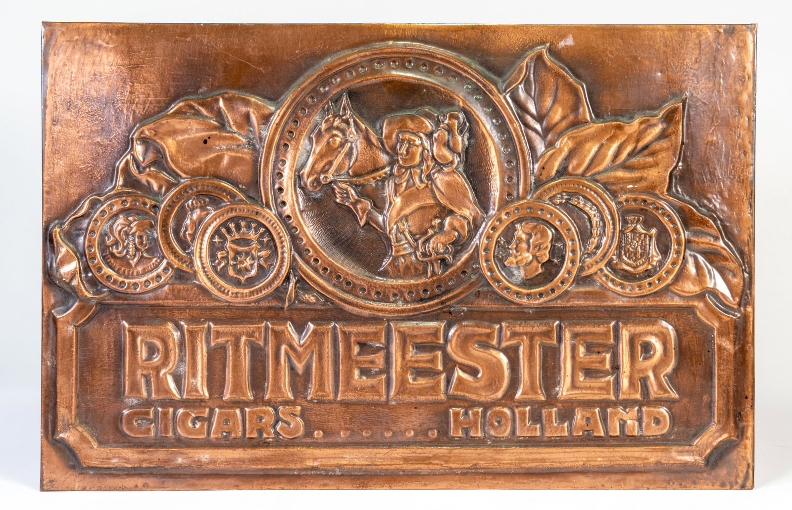 Vintage RITMEESTER CiGARS HOLLAND Copper Advertising Sign: Vintage Ritmeester Cigars Holland advertising sign. Raised copper?clad over metal back. Measures 13 x 19.5 in. No dents or damage.