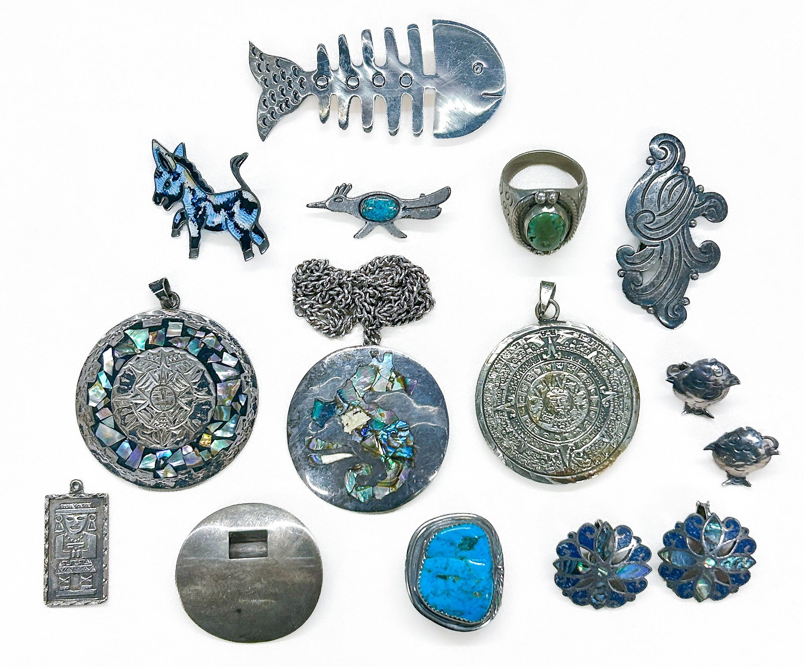 Sterling Silver Jewelry: Mexican sterling silver jewelry comprising of: Fish brooch, marked "925, Mexico, TV?94", 73 x 33 mm. Donkey enamel brooch, marked "925, Sterling Hecho en Mexico". Roadrunner pin with turquoise