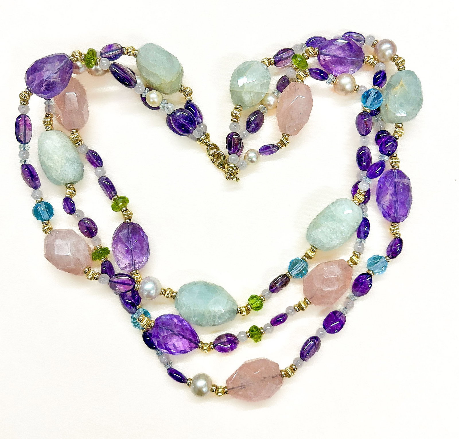 14k Gold & Gemstones Necklace: Quartz and amethyst faceted bead necklace with 14k gold spacers and lobster clasp. Total Weight: 93.5 dwt (145.4 g). Condition: No notable condition issues. |