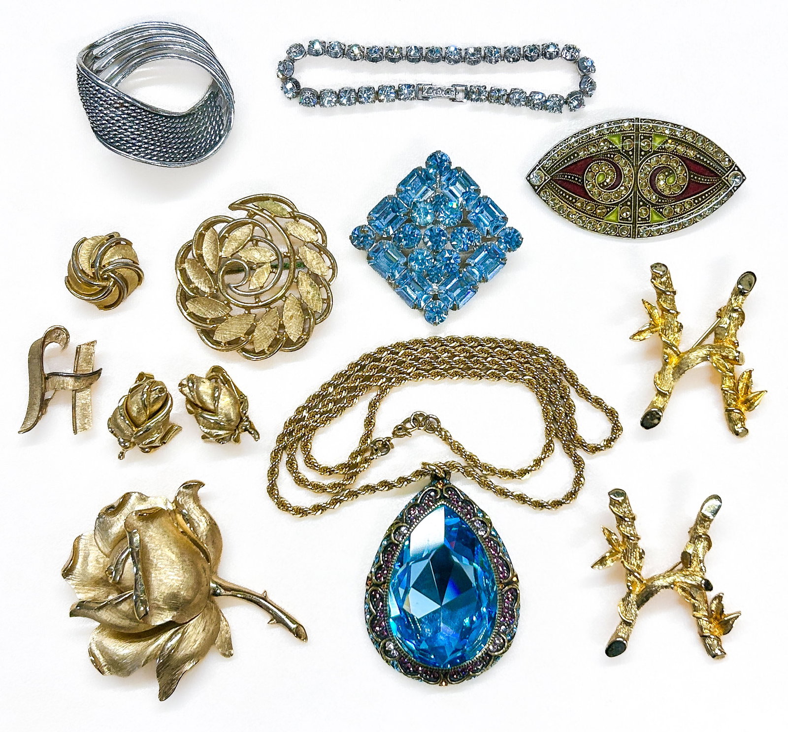 Signed Costume Jewelry: Twelve (12) signed costume jewelry pieces: Marcel Boucher, Kramer NY, Catherine Popesco, Trifari, Weiss, Heidi Daus, Monet, Sarah Coventry. Condition: No notable condition issues unless noted. |