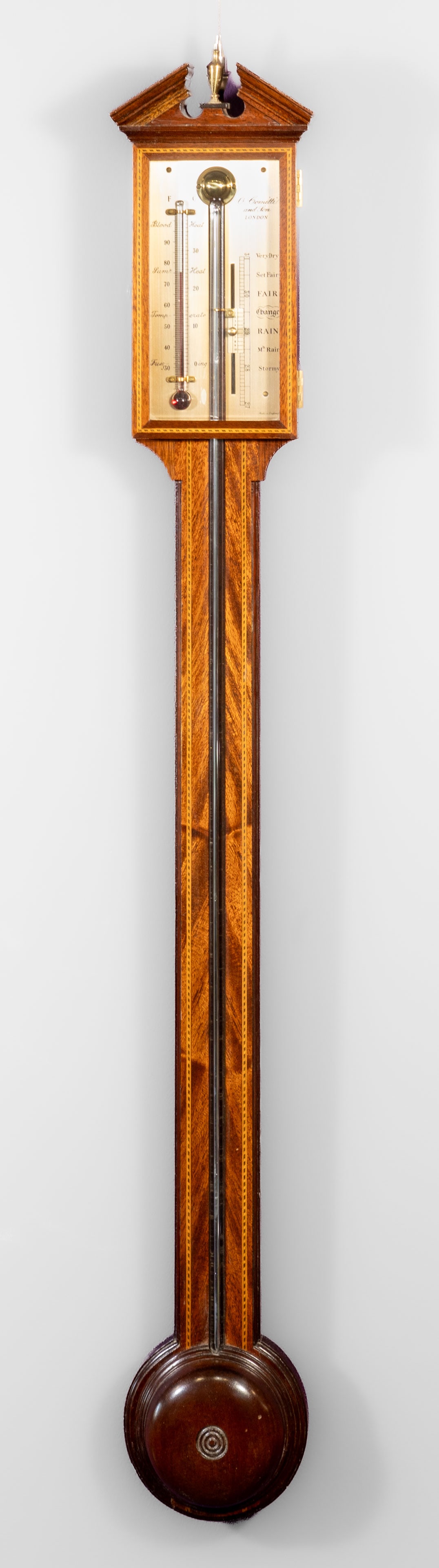English Edwardian Inlaid Mahogany Wall Barometer A Comitti & Son: A. Comitti & Son, London, inlaid wall barometer. Working condition. Measures 38.5 in. H x 5.5 in. W.