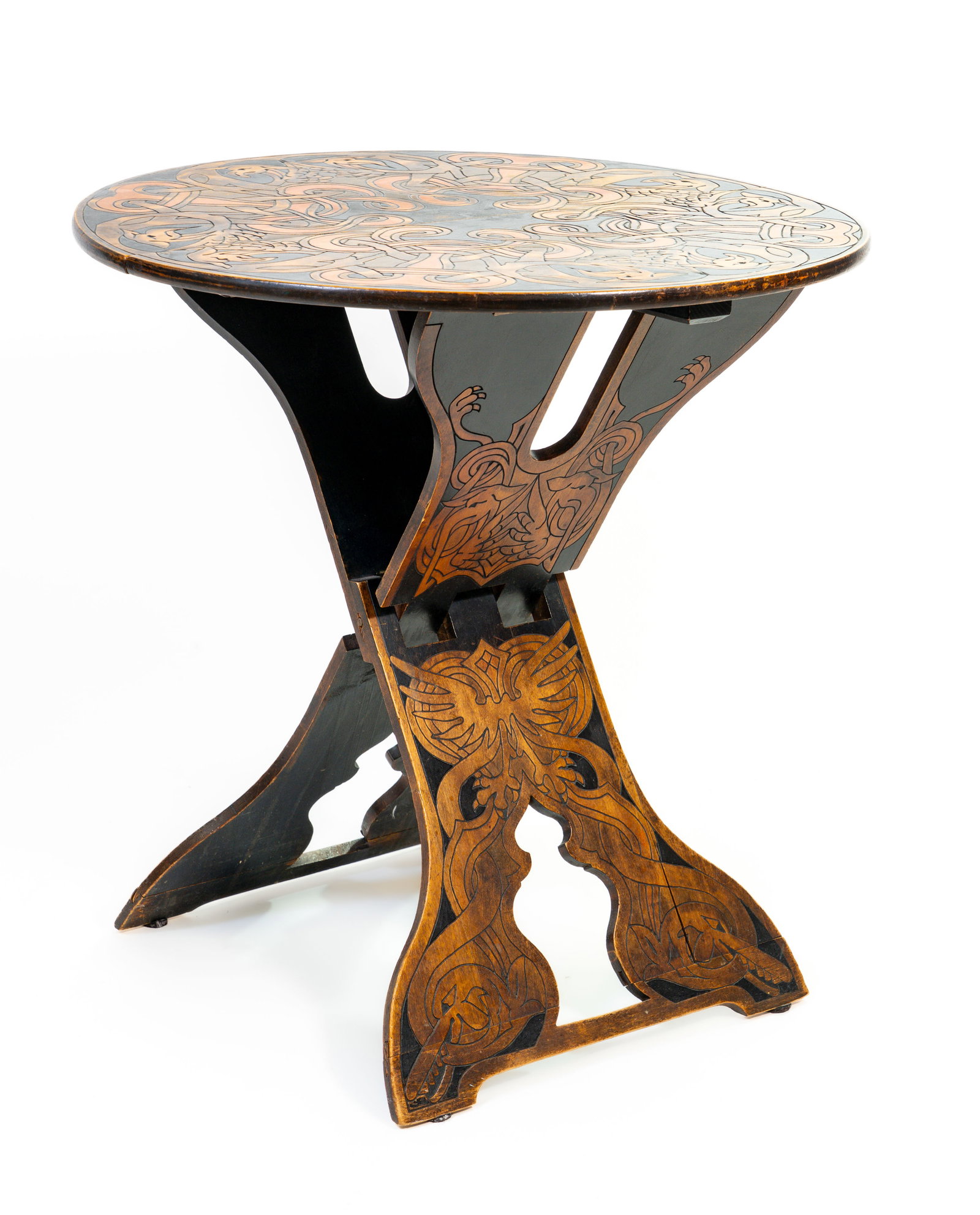 Art Nouveau Folding Table in the Moorish Style: Art Nouveau vintage carved and painted poker?work wood folding table. Dimensions: 25 in. high x 24.25 in. diameter when opened. Condition: Minor loss to paint throughout.