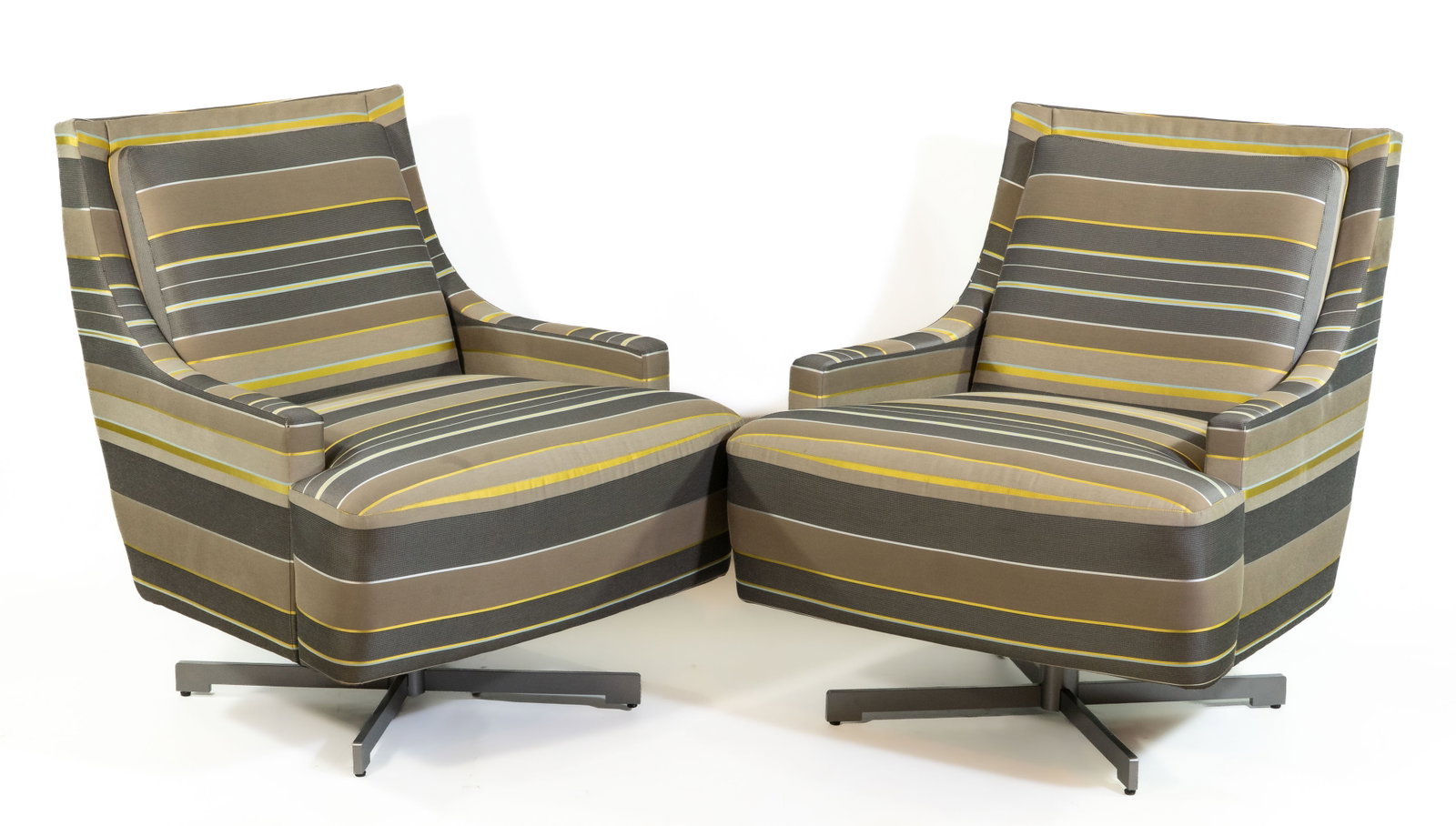 Pair Barbara Barry for HBF Swivel Chairs: Pair of Barbara Barry designed HBF swivel chairs on four?prong self?centering steel base, upholstered in striped grey, charcoal, and yellow fabric. Dimensions: 33.5 in. H x 28 in. W x 31 in. D. Seat h