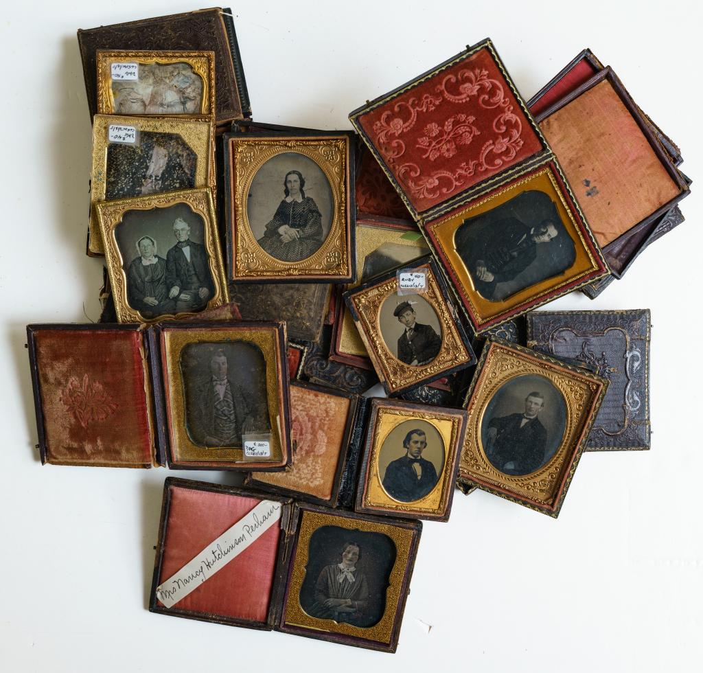 [DAGUERREOTYPE] 14 HARD IMAGES SOLD WITH EXTRA PARTS: A Collection of 14 hard images sold with a large quantity of case parts and preserves, from 1840s - 1860s, including: 9 daguerreotype images, mostly sixth plates, various conditions. * 5 ambrotype ima