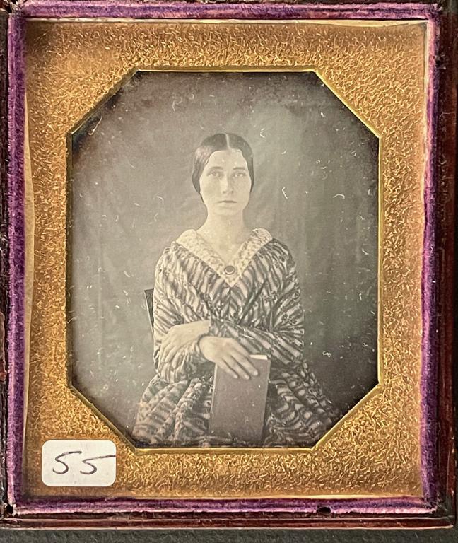 [DAGUERREOTYPE] PORTRAITS WITH BOOKS. LOT OF 3: Lot of 3 photographs of youngsters posing with books, including: Unknown daguerreotypist [Young man with books] Sixth plate daguerreotype, mat with gold decorations 1849 Provenance note: Found at Schu