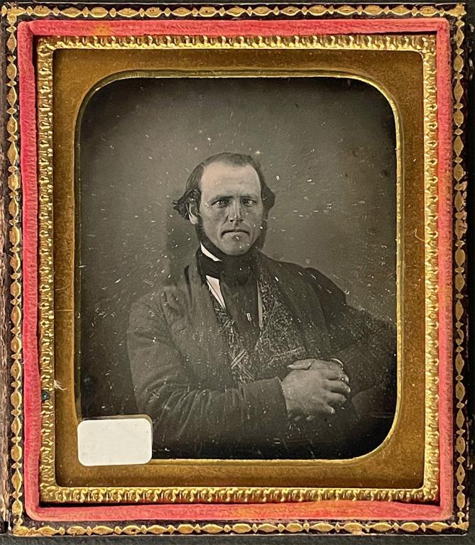 [DAGUERREOTYPE] PORTRAIT OF ID PLAQUE: Photography of a man with clasped hands. An etched silver plated plate inside front case identifies him as S. D. Wackman, aged 39 years, from Auburn [?], N.Y. Anonymous [Portrait of S.D. Wackman] Nint