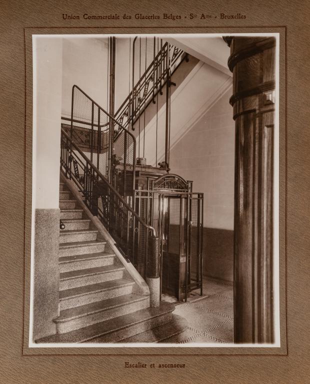 [ALBUMS] UNION COMMERCIALE DES GLACERIES BEIGES: BEIGES. Brussels. 22 large silver print photographs mounted within letter press borders. A commercial album showing the building, offices, and factories of this Belgium company. Oblong folio, faux rep