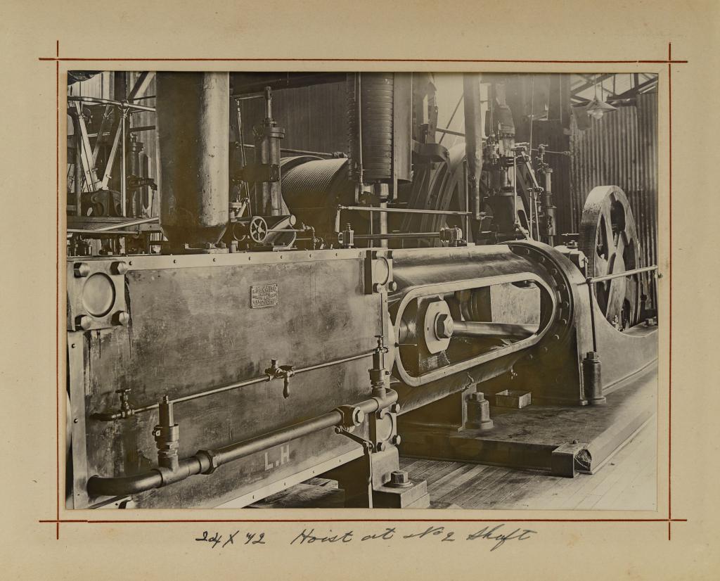 [ALBUMS] GOLD MINING SOUTH AFRICA: Oblong 4to. Leather backed cloth stamped "Photographs". 8 9/16 x 11.5 inches 12 silver print photographs showing the mining operations of Robinson deep mines and two 900 oz gold bars. Inscription insi