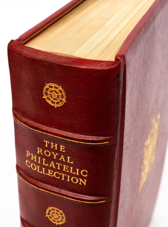 [PHILATELIC] WILSON, JOHN. ROYAL COLLECTION. 1952: PHILATELYWilson, John; Winchester, Clarence [editor]The Royal Philatelic Collection. London: The Viscount Kemsley, 1952. Folio. Full red morocco boards. Gilt stamp of royal crest on upper. Floral gilt