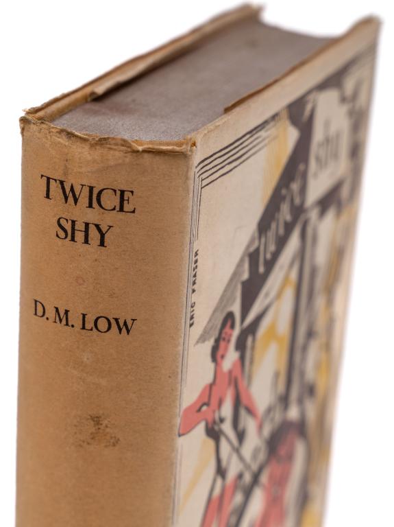 [LITERATURE] LOW, D. M. TWICE SHY. 1933: Low, D. M. Twice Shy. London: Chatto & Windus, 1933. 8vo. Full yellow cloth boards. Red lettering on spine. With rare printed dust jacket in art deco illustration.Additional images and detailed condit
