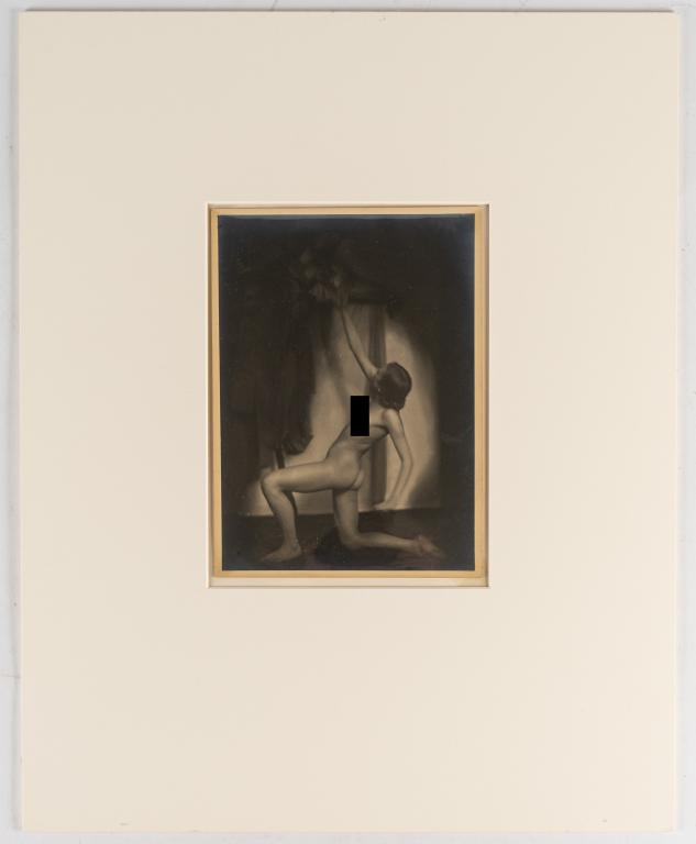 [PRINTS] KRULL, GERMAINE. KNEELING NUDE: KRULL, GERMAINE. Silver print photograph from back of nude woman kneeling, reaching towards object above. (1930). 23 x 16.5 cm. *Additional images and detailed condition reports are available upon req