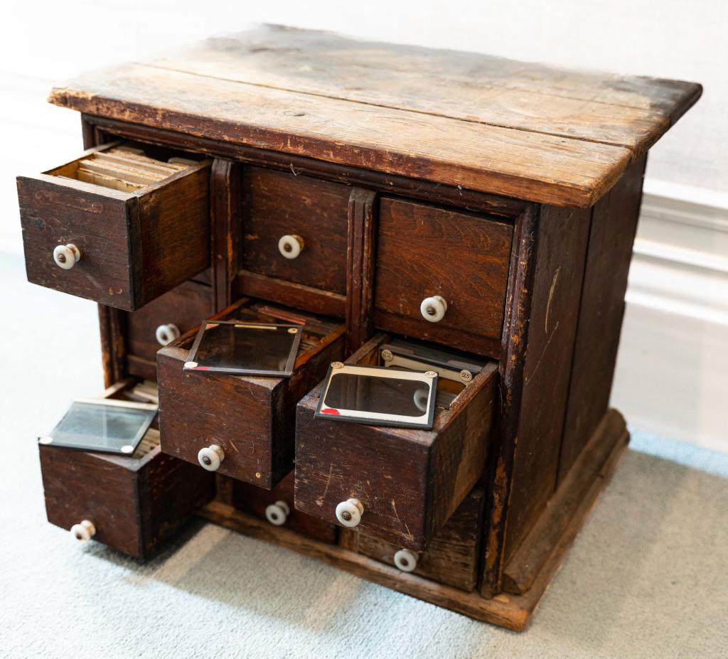 [LANTERN SLIDES] 418 SLIDES IN 9-DRAWER CHEST: LANTERN SLIDES. A chest with 9 drawers housing approximately 418 slides. Presbyterian Lantern Slide Dept. (Toronto); Frederick W. Moffat for the Lantern Slide Department (Weston, ON); E.W. Micklethwai