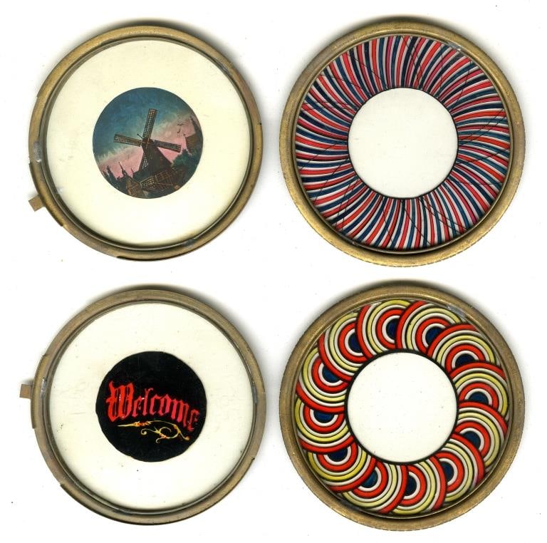 [LANTERN SLIDES] MECHANIZED, KALEIDOSCOPIC. 32: LANTERN SLIDES. Art slides, glass rounds in wooden frames, mechanized/sliding. A lot of approximately 32 pieces. 10 frames, plus 16 kaleidoscopic or glass rounds, plus 1 rectangular slide, plus other 