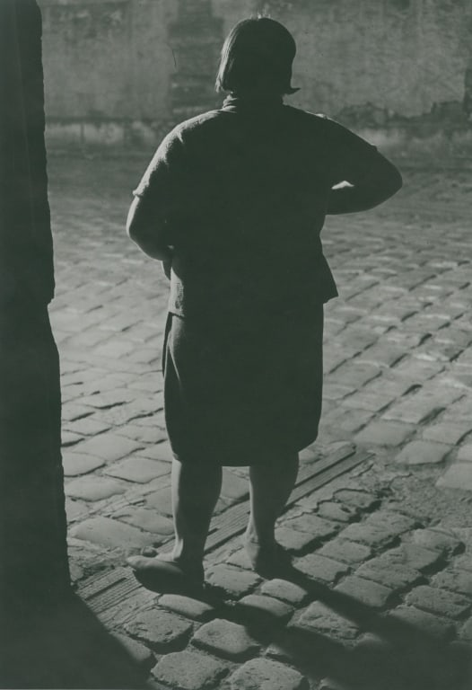 BRASSAI. FILLE DE JOIE. PARIS. 1932.: Brassai. FILLE DE JOIE, QUARTIER ITALIE. PARIS. 1932. Silver print mounted with plastic corners in mat. Print verso with Brassai's copyright backmark, pencil caption, marked "Tirage de l'Auteur" [Auth