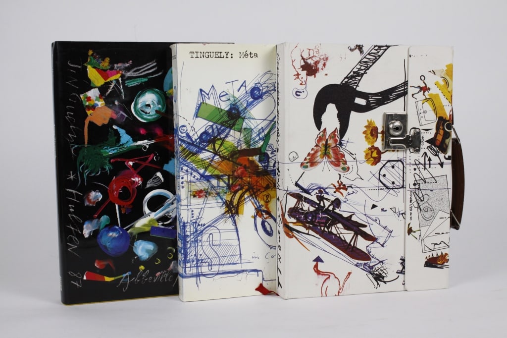 [TINGUELY, JEAN] LOT OF 3 VOLUMES SOLD TOGETHER: TINGUELY, JEAN. A lot of 3 volumes sold together. Including: Hulton, Pontus. JEAN TINGUELY: META. Boston: New York Graphic Society, 1975. Small folio. Housed in illustrated cloth "briefcase," with met