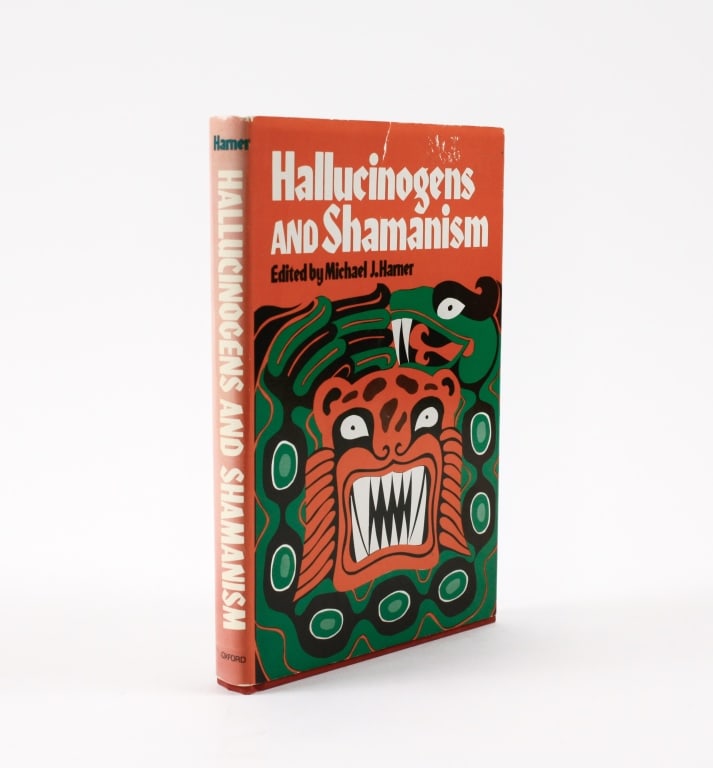 HARNER. HALLUCINOGENS AND SHAMANISM. 1973: Harner, Michael J. HALLUCINOGENS AND SHAMANISM. New York: Oxford University Press, 1973. 8vo. Red cloth boards, upper with green pictorial stamp. Spine lettered in gilt and green. With dust jacket, cl