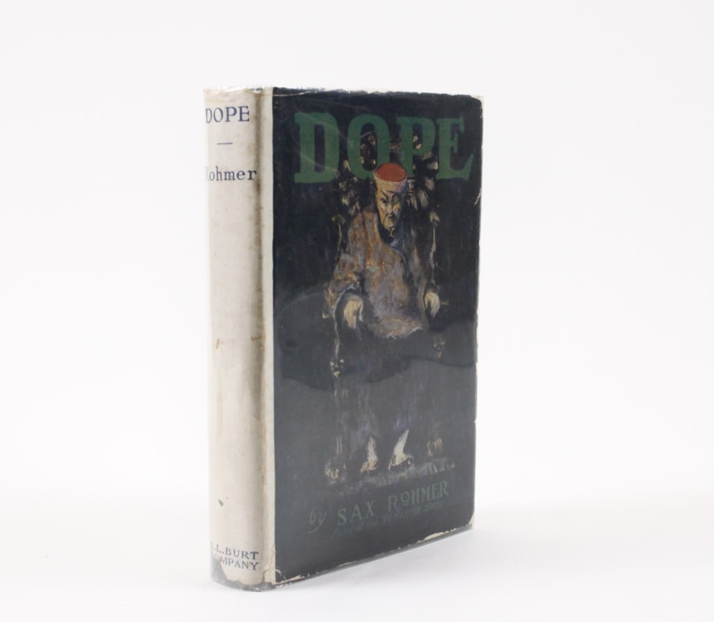 ROHMER, SAX. DOPE. 1919: Rohmer, Sax. DOPE. New York: A.L. Burt, September 1919. 8vo. Green cloth boards, dust jacket, corners clipped, in Mylar. Ownership inked on front pastedown. Generally good condition: jacket rubbed, so