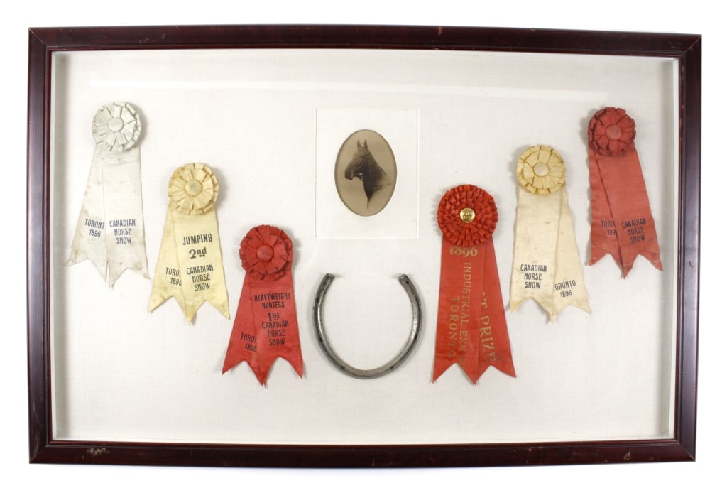 CANADIAN HORSE SHOW, 1895-6. RIBBONS & PORTRAIT: CANADIAN HORSE SHOW, 1895-1896. Framed group of 6 ribbons, plus horse shoe and albumen portrait of horse, signed Prince Charlie. One ribbon from the Industrial Exhibit, Toronto, 1896. Handwritten (per