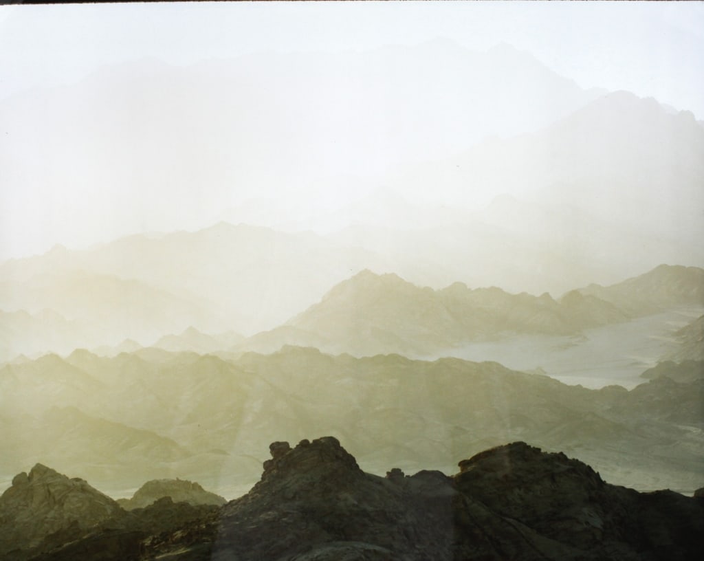 FOLBERG, NEIL. HAZE OVER MOUNTAINS, SINAI. 1982/3: FOLBERG, Neil. HAZE OVER MOUNTAINS, SINAI. 1982/3. Edition #11/75. Cibachrome print mounted with plastic corners in mat, with cardboard backing, verso with Vision Gallery (San Francisco) label, detail