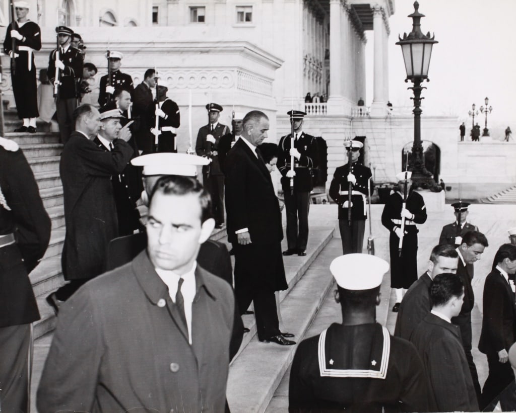 LYNDON B. JOHNSON AT KENNEDY'S FUNERAL: LYNDON B. JOHNSON AT JOHN F. KENNEDY'S FUNERAL. Silver print in mat. Print: 11" x 14"; mat: 16" x 20". Generally good condition, various imperfections: some creasing, etc. *Additional images and detai