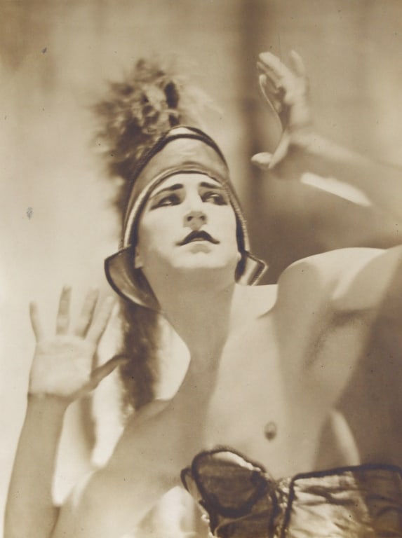 DE MEYER, ADOLF. HUBERT STOWITZ IN BALLET. 1920s: DE MEYER, ADOLF. "Hubert Stowitz in Dhiagilev Ballet." Circa 1920s. Toned gelatin silver print mounted on larger sheet signed by De Meyer on recto. In archival mat. Print: 9.25" x 7"; sheet: 16.25" x 