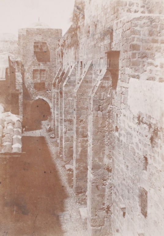 SALZMANN, AUGUSTE. JERUSALEM ST. SEPULCRE. 1854: SALZMANN, Auguste. JERUSALEM. SAINT-SEPULCRE. Face Ouest, Rue de Patriarche. Lille (France): Gide et J. Baudry, Blanquart-Evrard, circa 1854. Salt print. Numbered 79 at lower left. Print: 13" x 9.25";