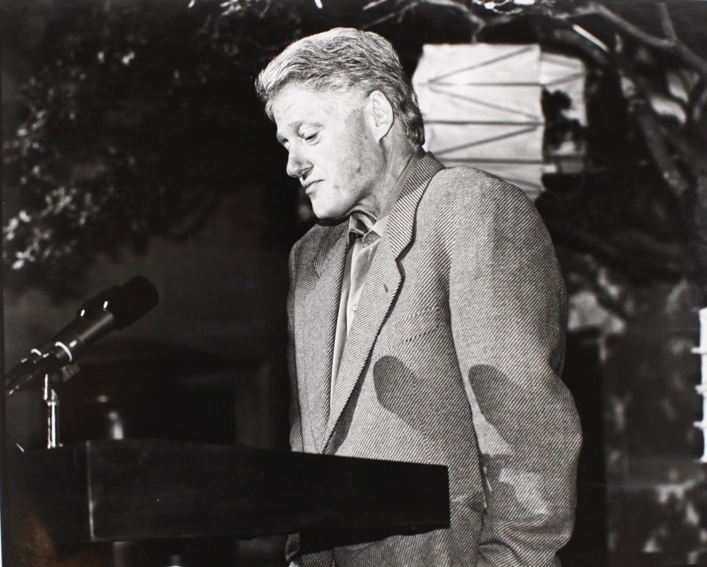 KENNERLY, DAVID H. CLINTON SHRUGGED. 2000: KENNERLY, David Hume. CLINTON SHRUGGED, Beverly Hills, California. "Photo du Jour" April 15, 2000. 1/50. Silver print in mat. Signed, details penned at lower margin. Mat with backstamp, signed and tit