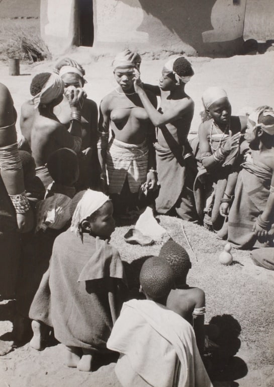 [AFRICA] BEAUTY PARLOR, BOCA TRIBE. 1955: Ralph Zouk (?). BEAUTY PARLOR, BOCA TRIBE. SOUTH AFRICA. 1955. Silver print mounted to board. Signed and titled in pencil at bottom edge. Date written on lower right corner of print. Mount verso with 