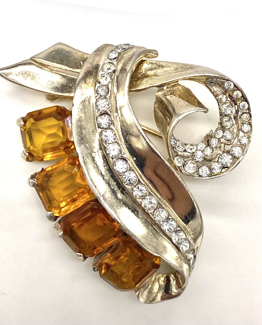 Retro 1940s Sterling Brooch: This beautiful 1940s sterling brooch with a gold wash is a beautiful example of the retro period. The quality of this pin makes me believe it is a designer unsigned brooch, possibly Mazer or Trifari??