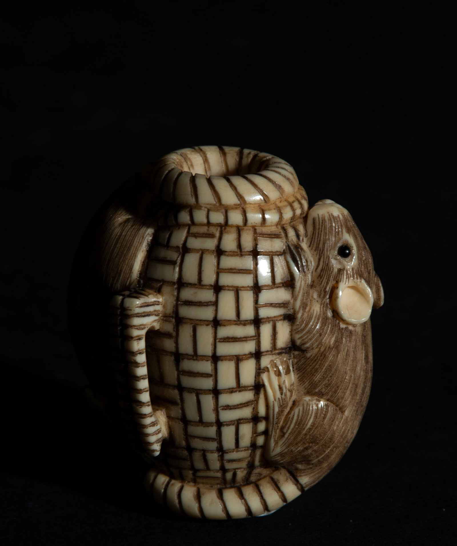 Japanese Netsuke on Mammoth Tusk (Mammuthus primigenius) depicting Mice in Barrel, 19th century: With artisan seal, measurements: 4.5 x 4 x 3 cm. Provenance: private collection of a lawyer and collector, Barcelona. Acquired in the 60s-70s in Paris.