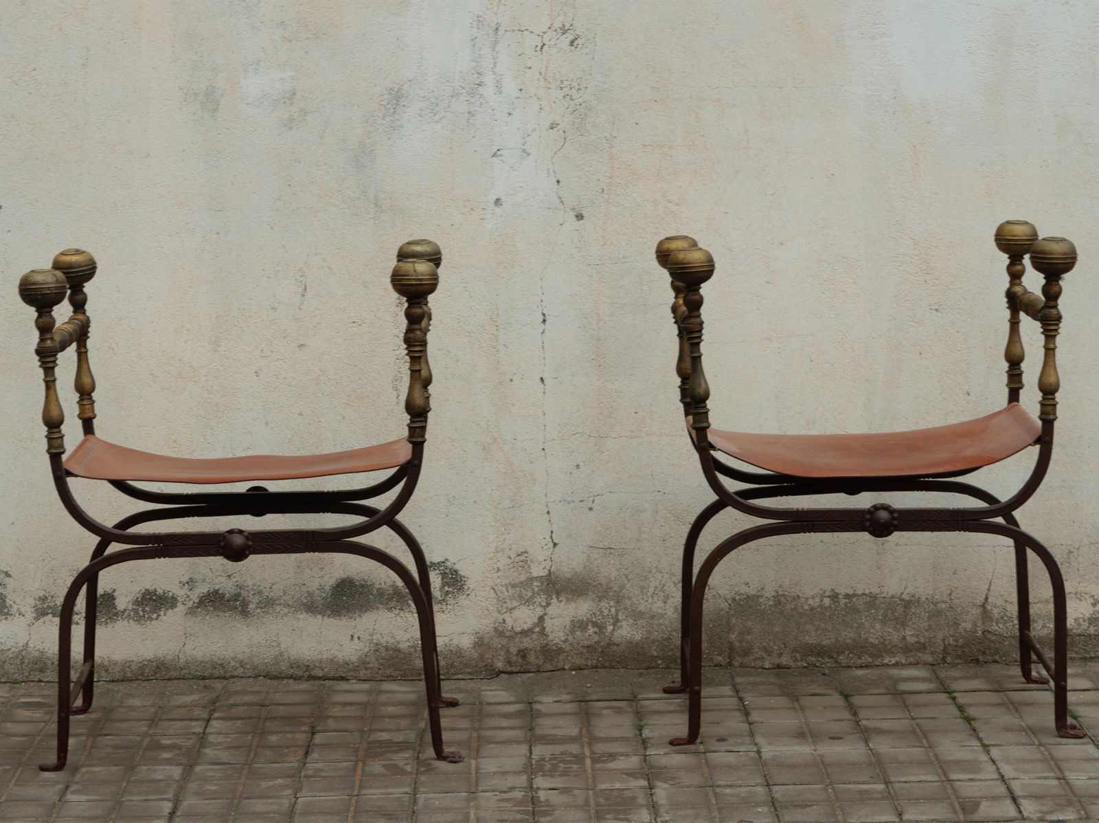 Pair of wrought iron and bronze jamugas, 19th century: Measurements: 89 x 73 x 48.