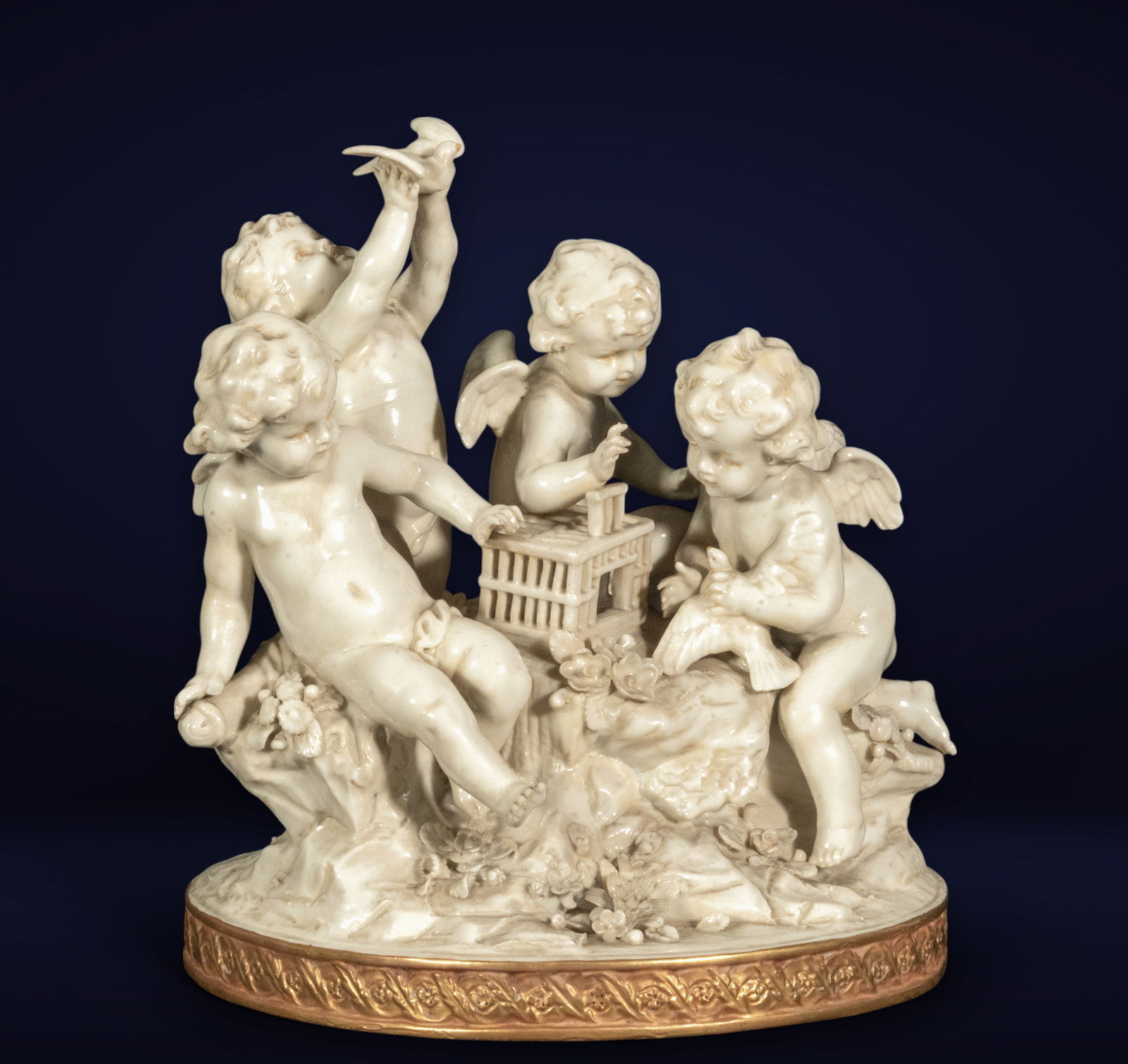 Exquisite Italian Capodimonte Porcelain Group from Naples, late 18th century to early 19th century, : With stamp on the base. Depicting the four Cupids, measurements: 28 x 19 x 20 cm, sealed, very good condition, only a small defect on the thumb of one of the Cupids. Reference bibliography: Martino, L